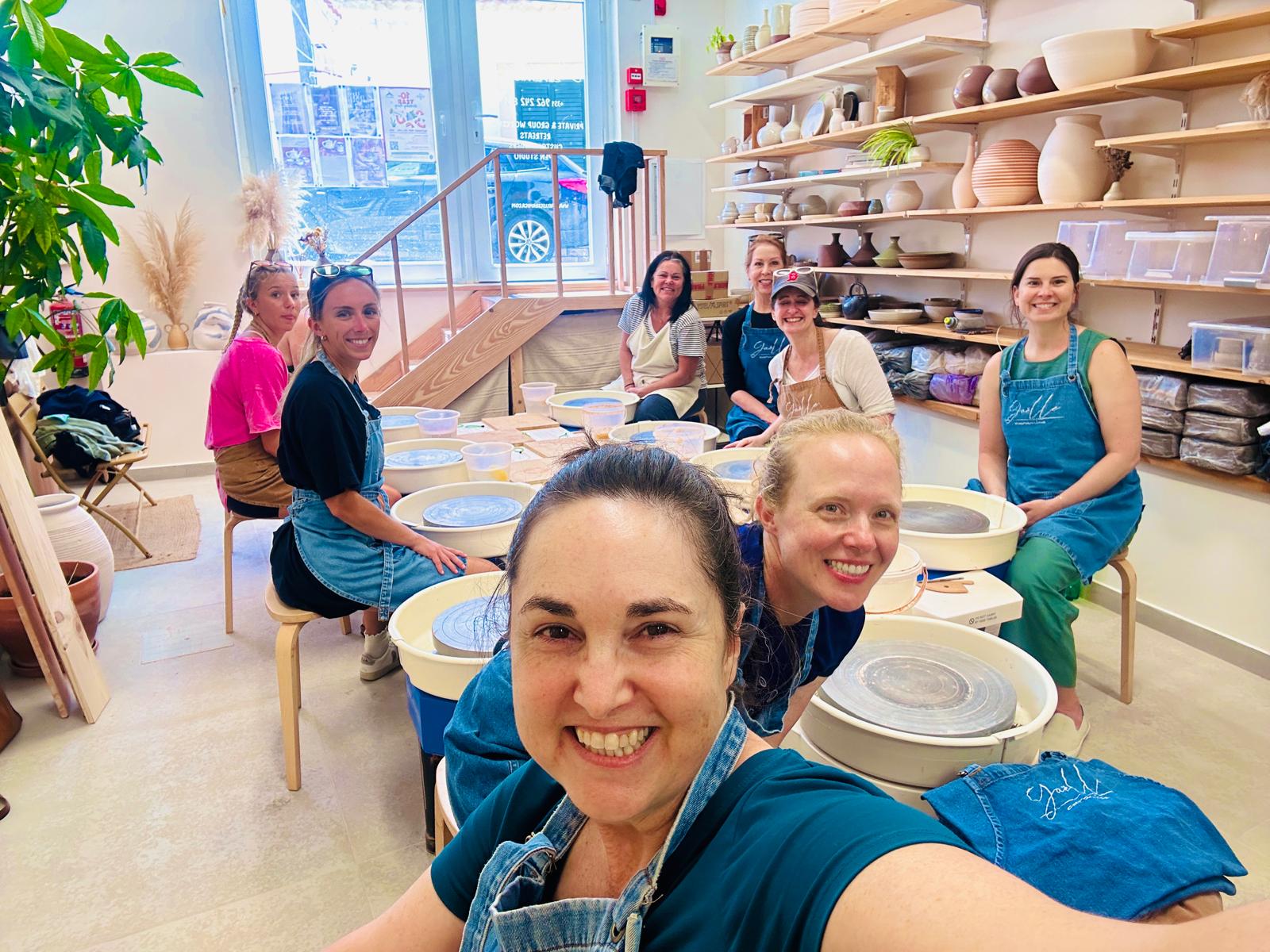 The group at the wheels in the ceramics studio