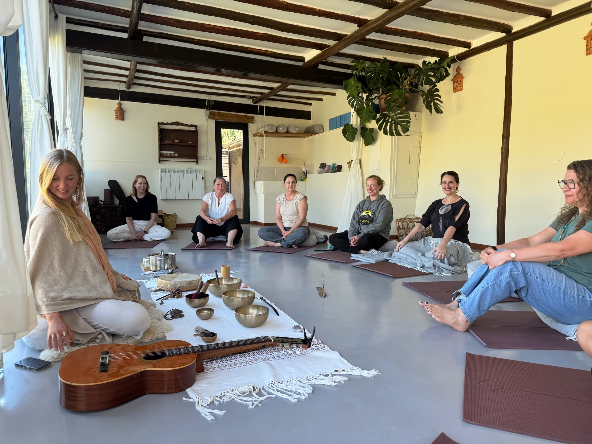 Sound bath circle in the studio with singing bowls