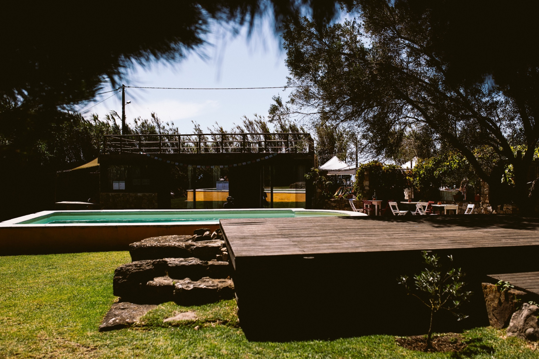 The pool and shaded gathering deck at Casa Paco d'Ilhas