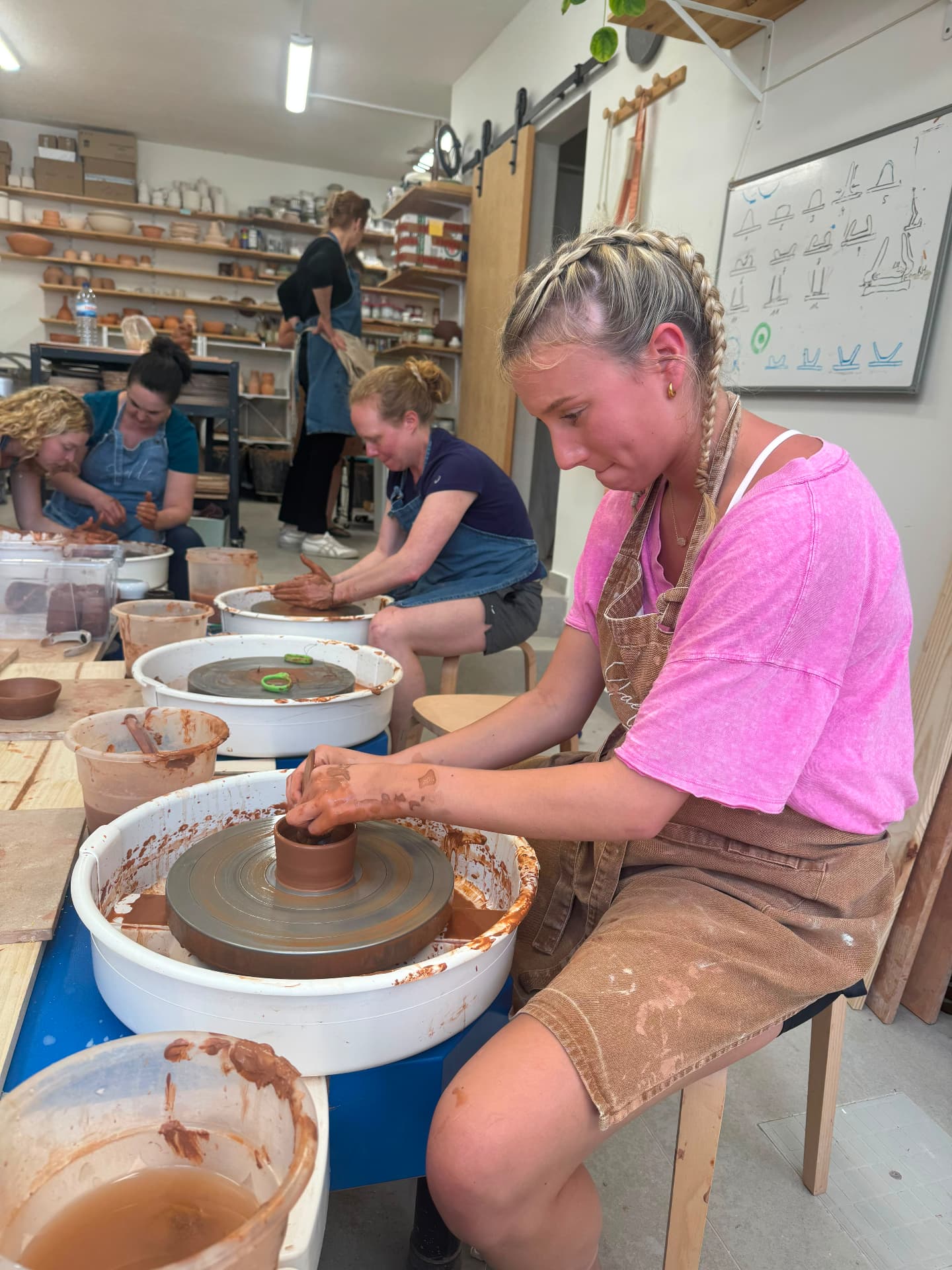 Throwing a small pot during the ceramics workshop