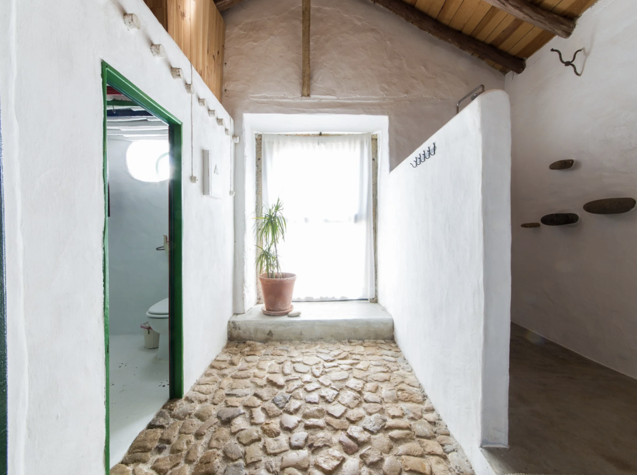 Whitewashed courtyard with terracotta and stone
