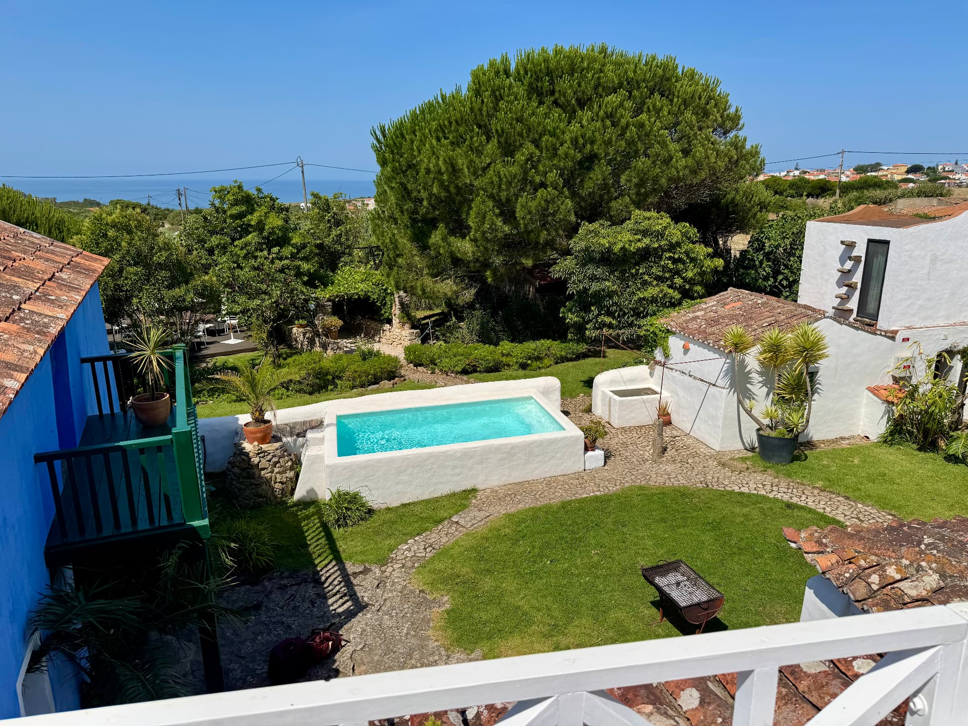 View over the pool and gardens to the Atlantic beyond