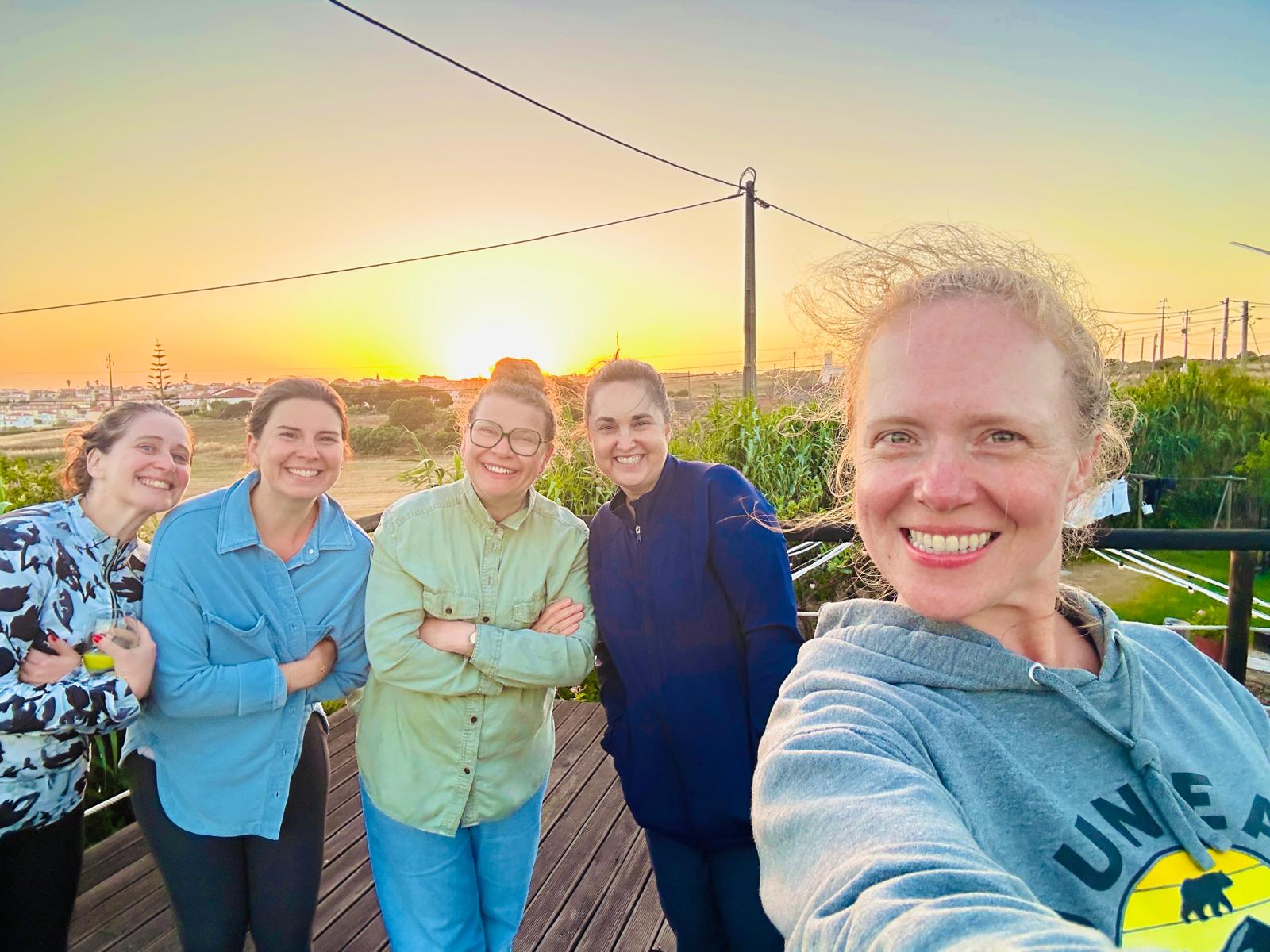 Guests on the deck as the sun sets over Ericeira